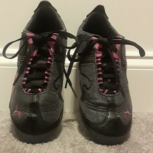 Women's black and pink Puma sneakers